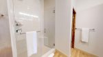 White tiled walk-in shower 